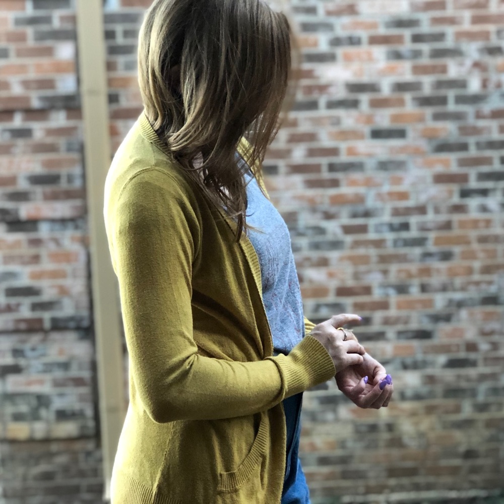 Yellow cardigan.